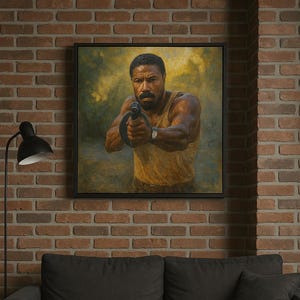 May include: A framed portrait of a man holding a weapon, set against a blurred background. The artwork is displayed on a brick wall above a dark gray sofa and black coffee table. A black lamp and a glass of liquid are also visible.