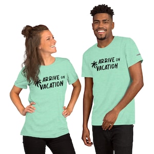 May include: Two people wearing light green t-shirts with a black palm tree and the text "Arrive on Vacation" printed on the front.