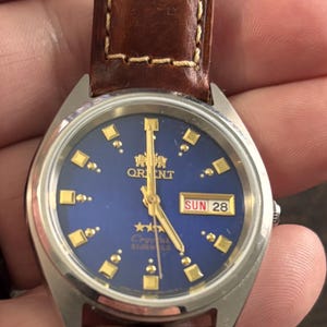 Orient Tri Star Day Date Automatic Watch