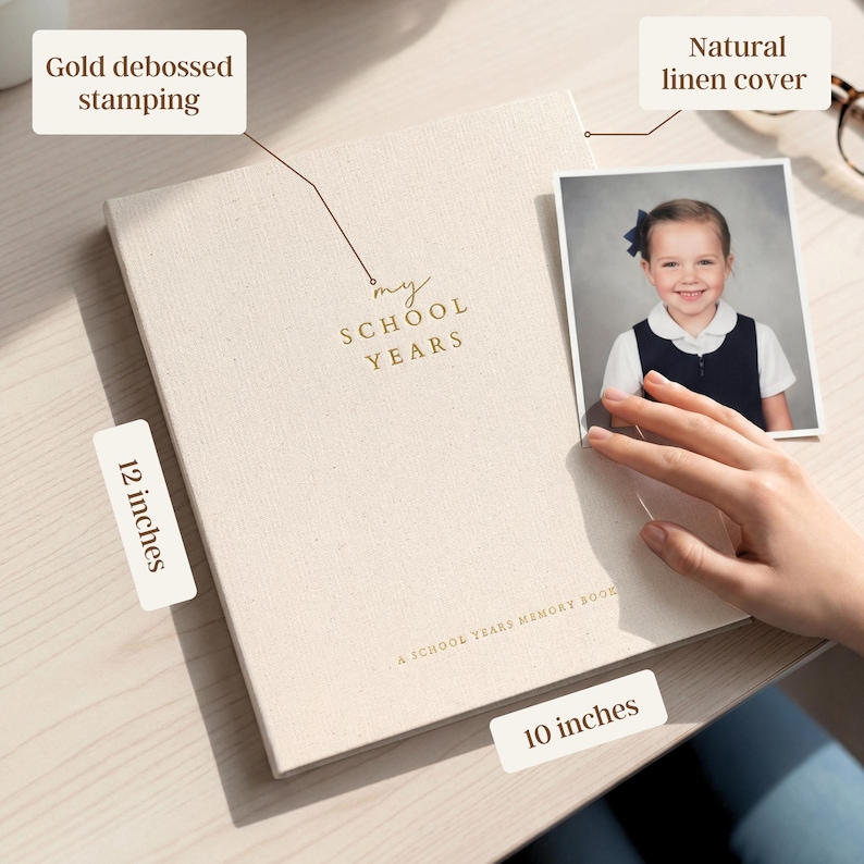 May include: A natural linen cover memory book with gold debossed stamping that reads "my SCHOOL YEARS". The book is 12 x 10 inches. A photo of a young girl is next to the book.