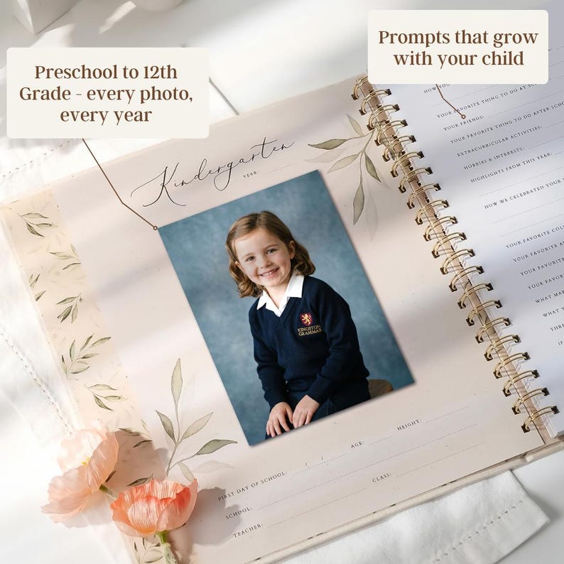 May include: A spiral-bound photo album with a picture of a young girl in a school uniform. The album is open to a page labeled "Kindergarten" with prompts and space for photos. Text on the album reads "Preschool to 12th Grade - every photo, every year."