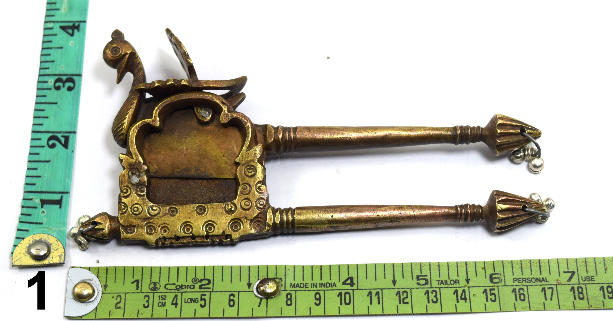 Sold at Auction: A metal gold inlaid betel nut cutter decorated with Naga  and gold lotus bud at handle