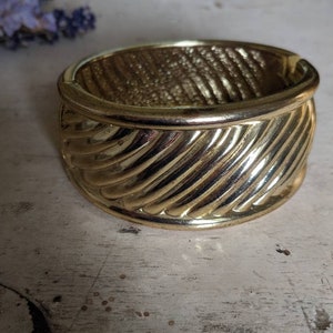Vintage 1970's heavy gold tone magnetic bangle