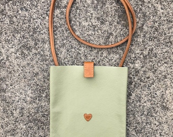 Crossbody leather handbag with heart design