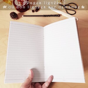 May include: A brown notebook with lined pages. The text on the cover reads "Pages lign&eacute;es - ou non lign&eacute;es sur demande" and "Lined pages - or no-lined on request".