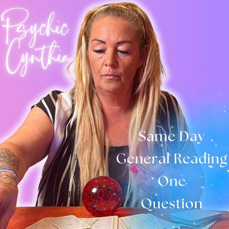May include: Image featuring a woman with blonde hair, a black and white striped top, and the text "Psychic Cynthia." A red crystal ball and tarot cards are on a table. Text on the image reads "Same Day General Reading One Question."
