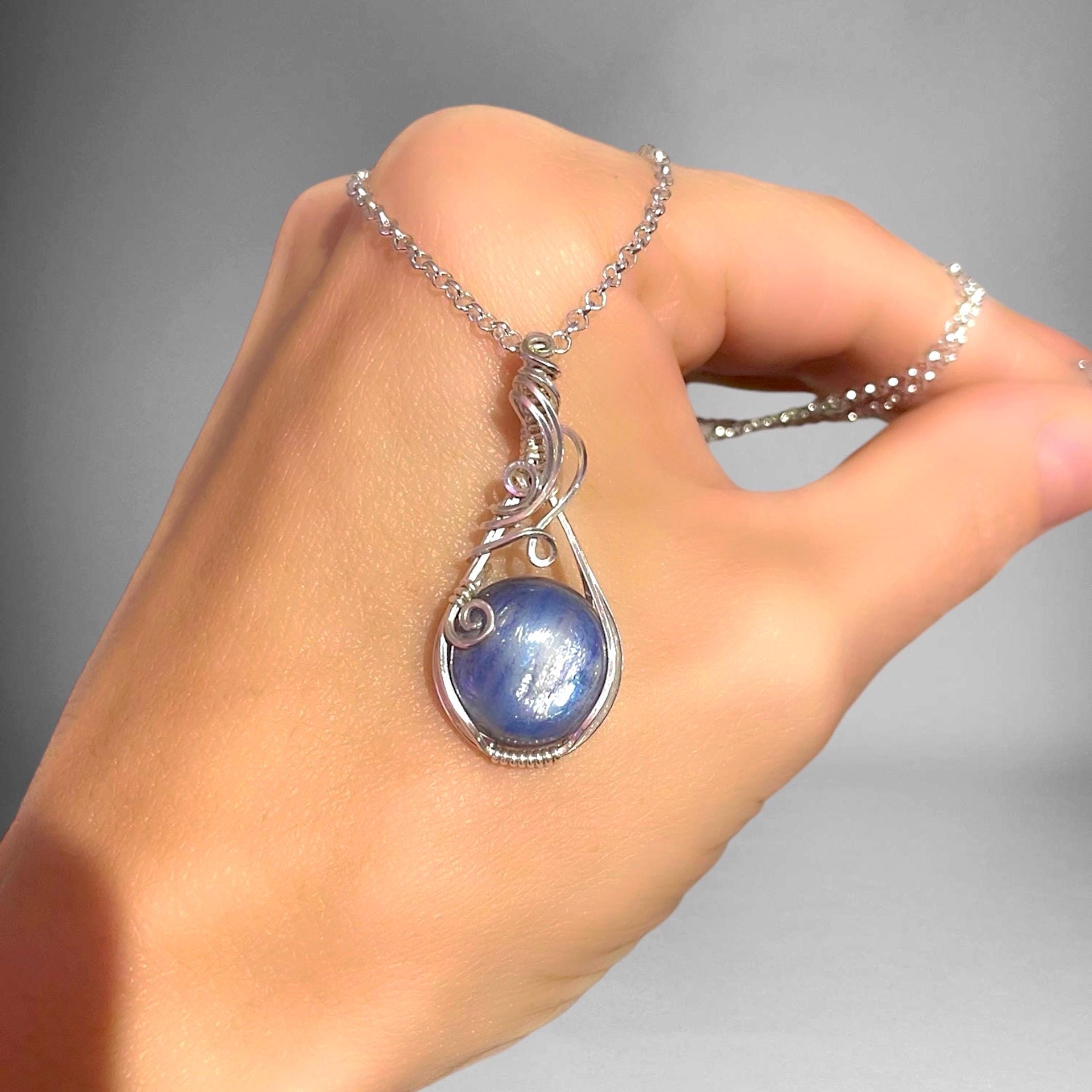 Kyanite pendant wrapped in 925 Sterling silver. Wire wrapped gemstone. Handmade silver jewelry. Boho jewelry.