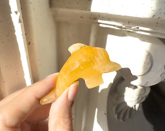 Hand Carved Orange Calcite Dolphin Figurine: Healing Crystal Decor (3")