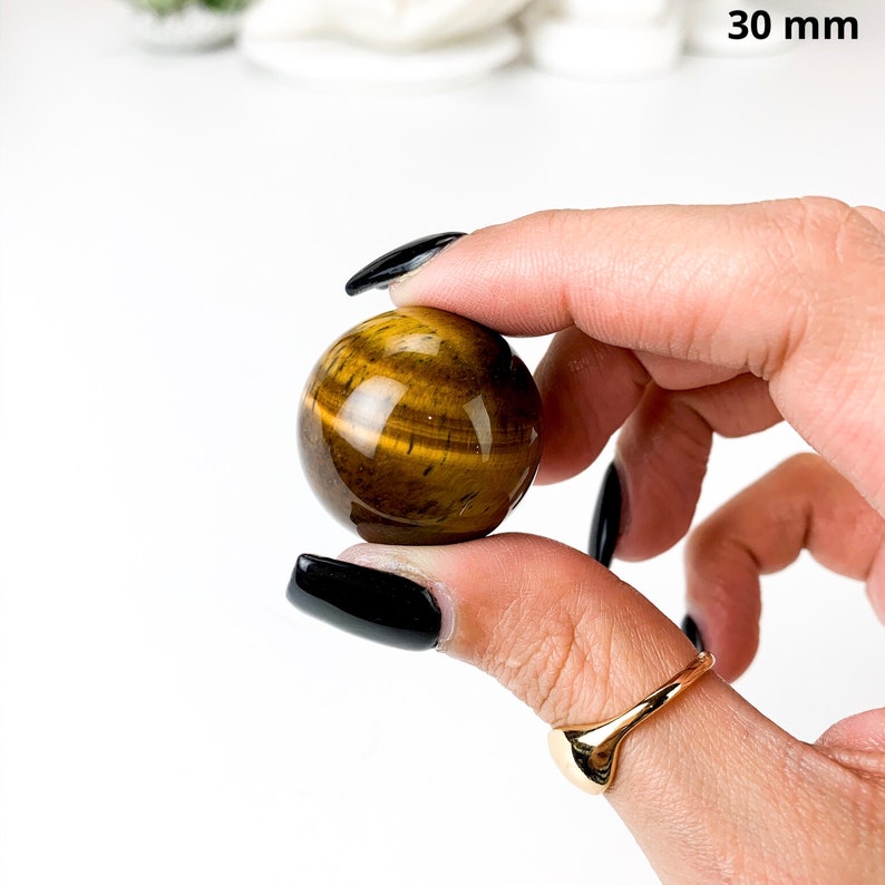 Gleaming Yellow Tiger Eye Crystal Ball: A Stunning Sphere of Power and Protection image 3