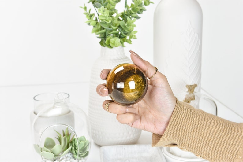 Gleaming Yellow Tiger Eye Crystal Ball: A Stunning Sphere of Power and Protection image 1
