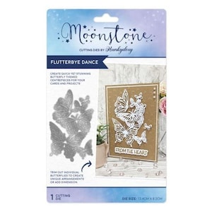 May include: A Moonstone cutting die set for card making. The set includes a die cut of several butterflies and a sample card with white butterflies on a brown background. The die size is 13.4cm x 8.2cm.