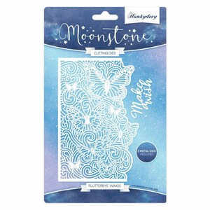 May include: A package of Moonstone Flutterbye Wings cutting dies. The white die-cut design features butterflies and swirling patterns. The package has a blue and purple background with the words "Make a wish" in cursive.