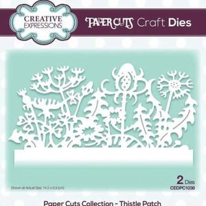 May include: White paper craft die featuring a detailed thistle patch design. The die includes various floral elements, including dandelions and other wildflowers. The actual size is 14.5 x 6.9 cm.