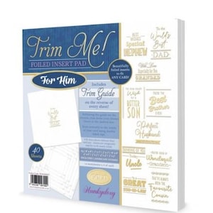 May include: A card-making kit labeled "Trim Me!" with a blue and gold design. The kit includes a foiled insert pad "For Him" with 40 sheets and a trim guide. The kit also includes gold foiled inserts to fit any card.