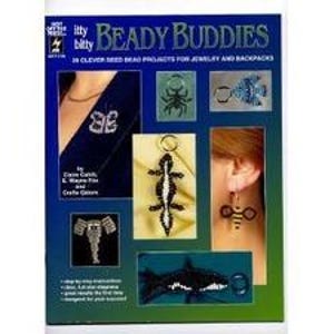 May include: A book cover titled "Beady Buddies" with images of beaded jewelry projects. The cover features a blue background with various beaded creations, including a butterfly, a spider, a fish, a lizard, an elephant, a shark, and a bee earring.