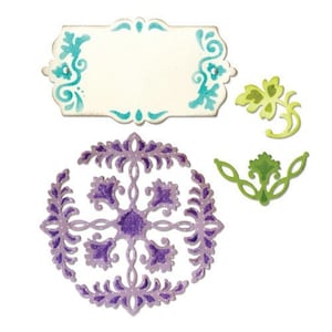 May include: A set of four decorative die-cut stencils featuring intricate floral designs. The stencils are in shades of green, blue, and purple.