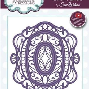 May include: A purple craft die set by Sue Wilson. The set includes six dies with an ornate, oval design. The packaging features the Creative Expressions logo and states the actual size of the die is 3.8 x 3.6 inches. The product code is CED4352.