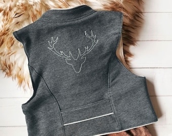 May include: A dark gray sleeveless vest featuring a white embroidered deer antler outline on the back. The vest has a high collar, a horizontal seam detail across the lower back with white piping, and a light-colored interior lining visible at the edges.