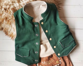 May include: A green vest with white trim and gold buttons. The vest has a small pocket on the front and is made of a soft, comfortable fabric.