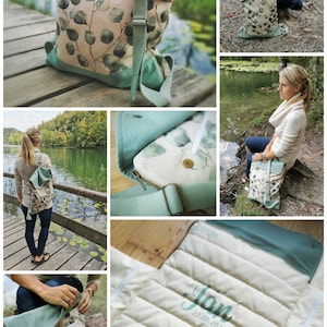 May include: A green and beige canvas bag with a leafy pattern and a zipper closure. The bag has a long adjustable strap and is shown in various settings, including a woman wearing it and a close-up of the fabric.