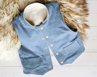 May include: A blue sleeveless vest featuring a cream-colored inner lining, a stand-up collar, and a front button closure with metallic snaps. The garment includes two front pockets with pointed flaps and displays the text 86 and LING FADEN.
