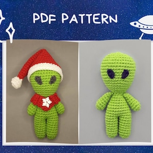 May include: PDF pattern for crocheting two green alien amigurumi toys. One alien is wearing a red Santa hat and a white snowflake scarf. The pattern is titled "PDF PATTERN".