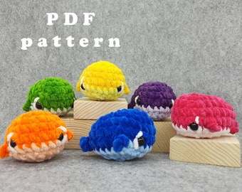 May include: PDF pattern for crocheting six colorful pufferfish amigurumi toys. The pufferfish are yellow, green, purple, pink, blue, and orange.