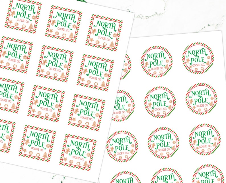 May include: A sheet of white paper with 24 round and square stickers featuring a green and red striped border. The stickers have a gingerbread man and Christmas tree design with the text "North Pole Cookie Co."
