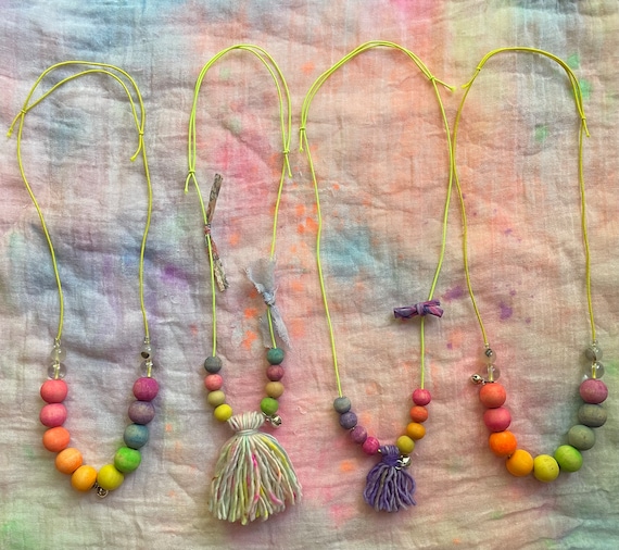 Wooden Rainbow Bead Necklaces with Yellow Cord Sterling Silver Jingle Bell Hand Dyed Ribbon and Liberty Fabric Bows