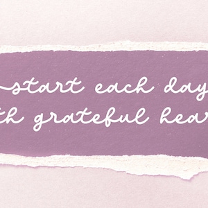 May include: A pink and white textured background with a torn edge revealing a purple background. The text "start each day with grateful heart" is written in white cursive script.