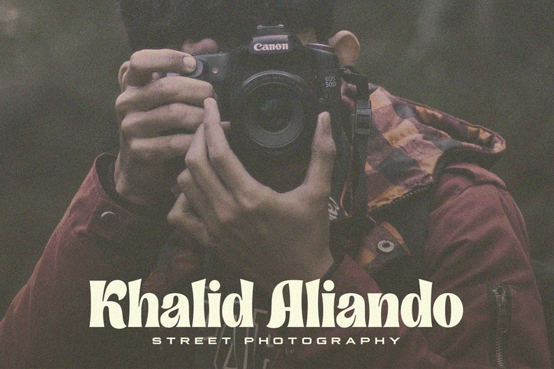 May include: A person holding a Canon camera, with the text "Khalid Alliando STREET PHOTOGRAPHY" below.