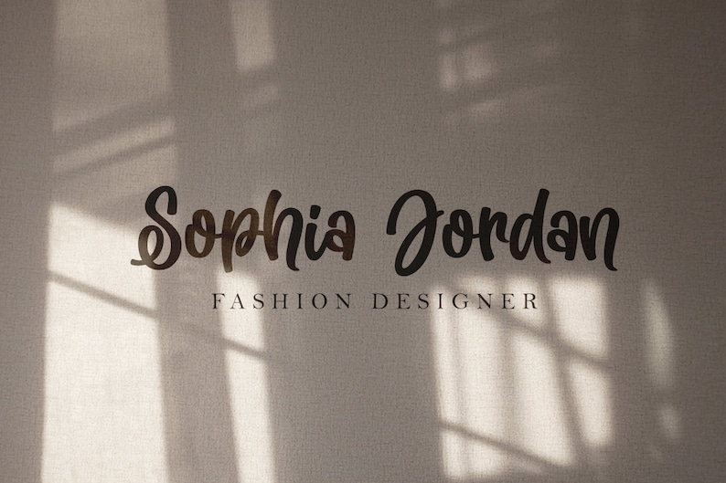 May include: A white wall with a shadow of a window behind the text "Sophia Jordan Fashion Designer".