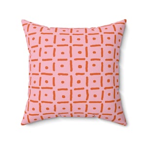 Cuscino decorativo con quadrati punteggiati giocosi - arancione su rosa