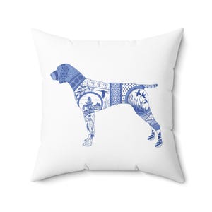 May include: White throw pillow with a blue and white silhouette of a dog. The dog is made up of a pattern of blue and white Chinese porcelain designs.
