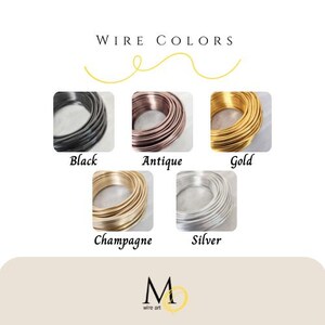 May include: Image showcasing wire colors: black, antique, gold, champagne, and silver. Each color is displayed in a tightly wound coil. The text "WIRE COLORS" is at the top, with the logo "M wire art" at the bottom.