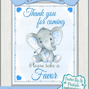 May include: A blue and gray baby shower sign with a cartoon elephant and the text "Thank you for coming. Please take a favor."