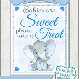 May include: A blue and gray printable sign with a baby elephant illustration and the text "Babies are Sweet Please take a Treat". The sign is decorated with blue hearts and has a blue banner at the top that says "Baby Shower Sign".