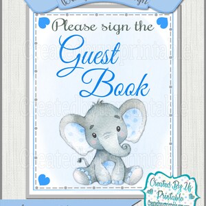 May include: Blue and gray baby shower sign with a cute cartoon elephant and the text "Please sign the Guest Book".