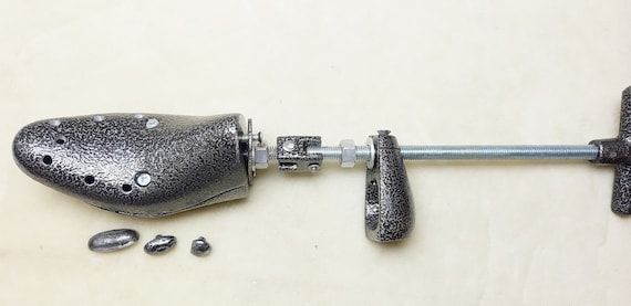 Metal shoe shop stretcher