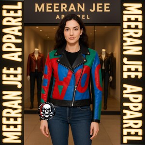 May include: A woman wearing a colorful leather jacket with the word "LOVE" in red, blue, and green. The jacket has a black collar and zipper. The store name "MEERAN JEE APPAREL" is visible in the background.