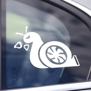 May include: White vinyl sticker of a snail with a turbocharger for a shell. The snail is blowing exhaust out of the turbocharger.
