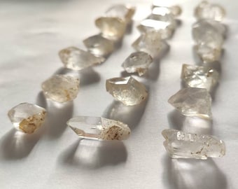 Puntas de cuarzo hialino crudo transparente