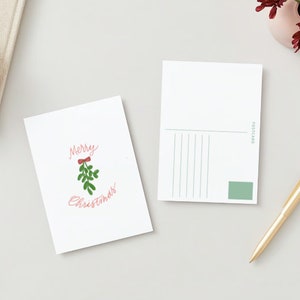 Fröhlicher Mistelzauber: Aquarell Weihnachtspostkarte mit festlichen Grüßen