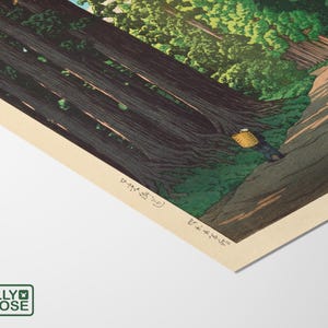 May include: A woodblock print depicting a path through a dense forest of tall trees. The path leads to a clearing where a person with a basket is walking. The print is in shades of green, brown, and blue.