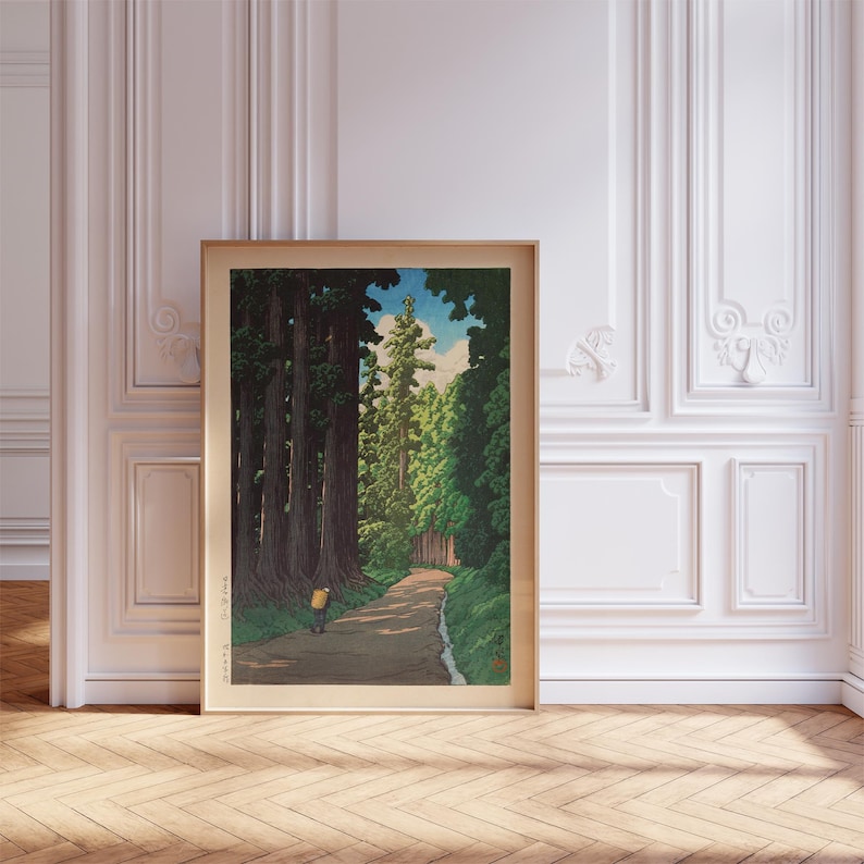 May include: A woodblock print showing a path through a forest of tall trees. The path is lined with trees on both sides, and the sun is shining through the leaves. A single figure walks along the path, wearing a yellow shirt and carrying a backpack.