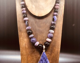 Charoite necklace with silver accents.