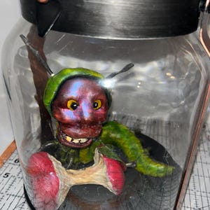 Handmade fantasy monster polymer clay and resin sculpture horror very hungry caterpillar