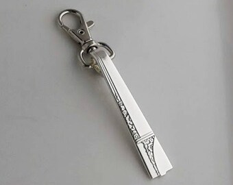 1009 / Brelok w kształcie srebrnej łyżeczki i nożyczek - Caprice 1937.