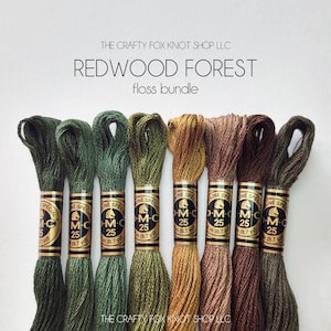 May include: A bundle of six DMC embroidery floss spools in shades of green, brown, and gold. The spools are labeled "DMC Special" and "25" with the text "The Crafty Fox Knot Shop LLC" at the bottom of the image.