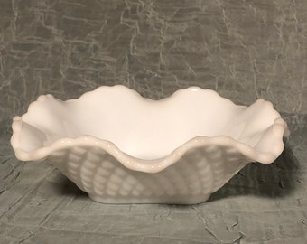 May include: White milk glass bowl with a scalloped edge and a textured, woven design.